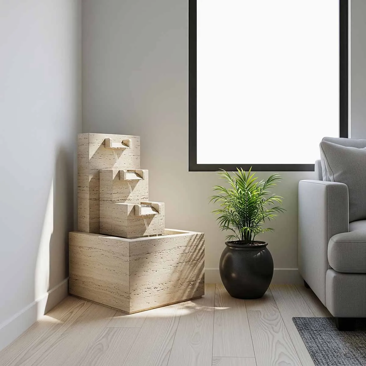 آبنما سنگی خانگی مدرن با جریان آب آرام در کنار مبل خاکستری و پنجره بزرگ، مناسب دکوراسیون آپارتمان